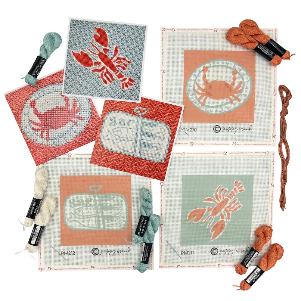Needlepoint kit flat lay showing three ocean designs
