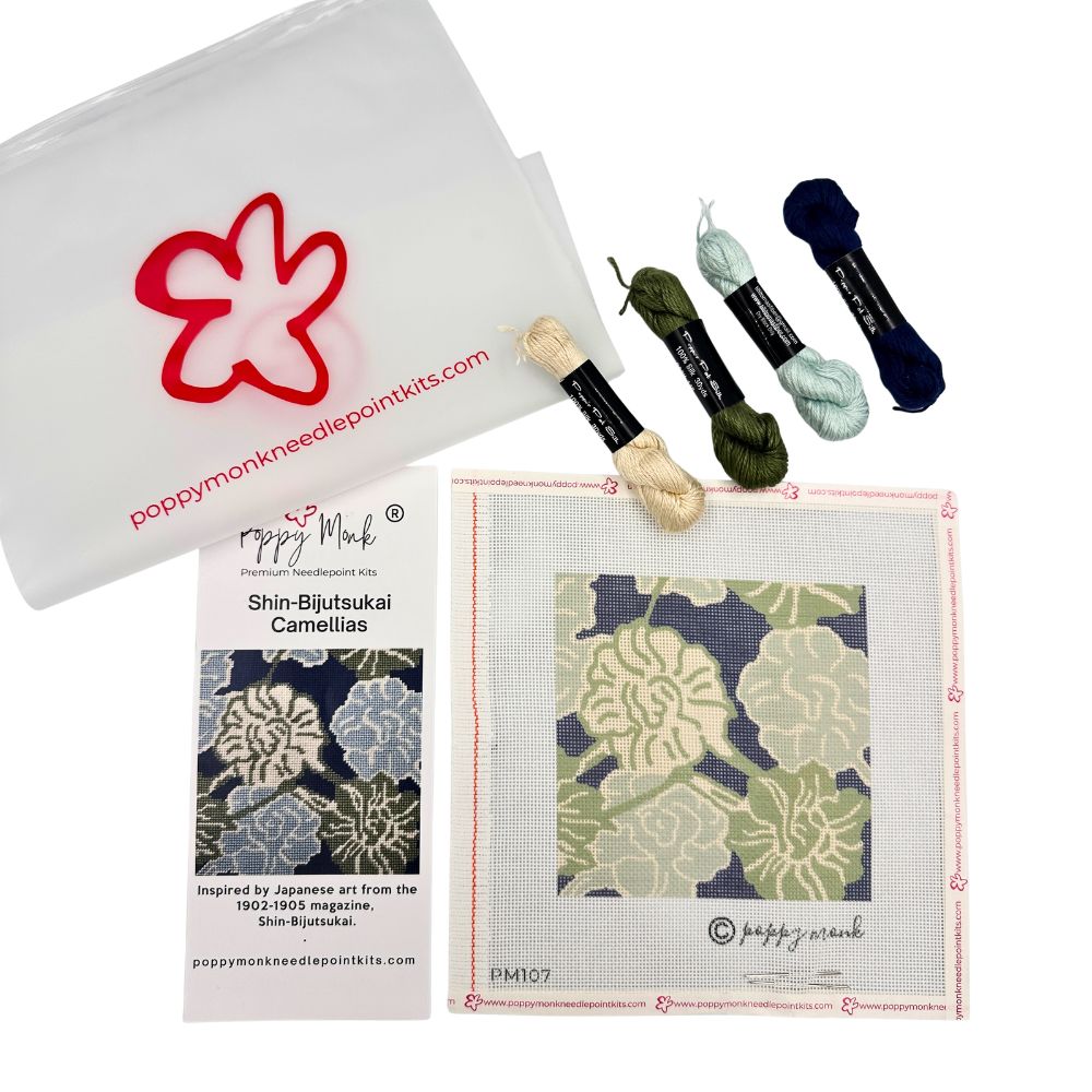 A needlepoint kit with abstract floral design and four skeins of silk threads