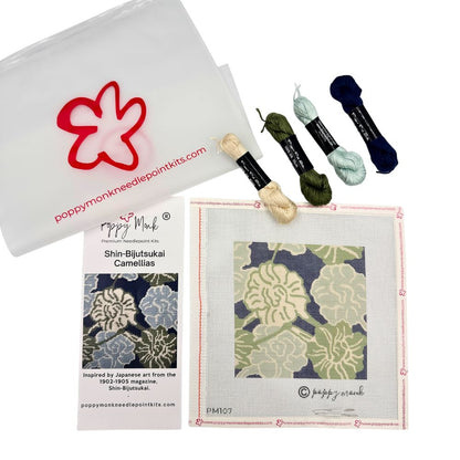 A needlepoint kit with abstract floral design and four skeins of silk threads