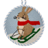 A needlepoint ornament of a hare on a sled