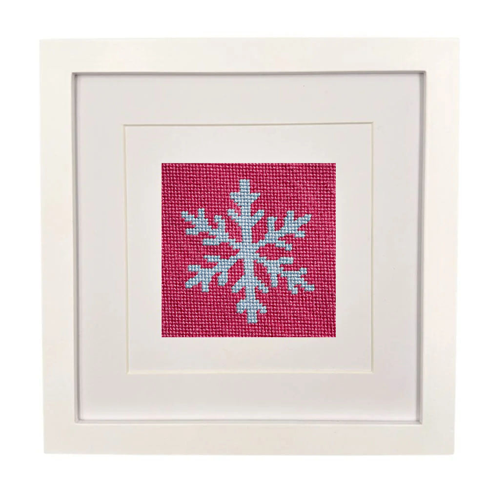 The Snowflake design stitched and in a white frame.