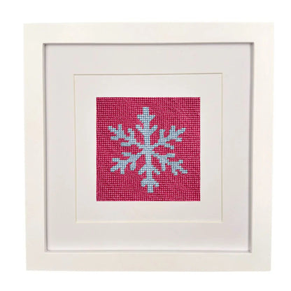 The Snowflake design stitched and in a white frame.