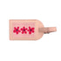 A light pink leather luggage tag featuring a rectangular canvas insert with three embroidered red flowers with blue centers, and a matching leather loop on the right.