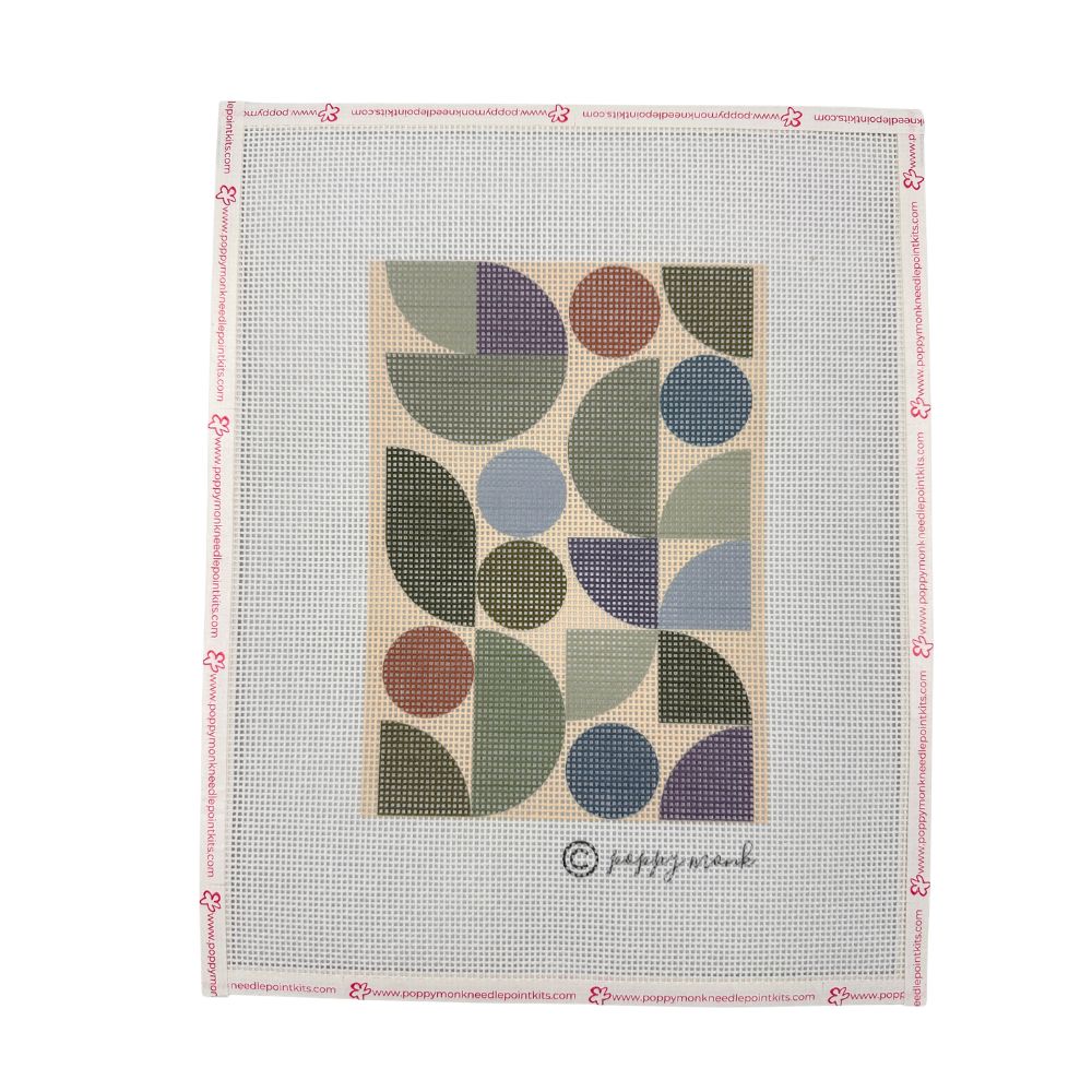 A needlepoint canvas featuring a mid-century modern geometric pattern with semicircles and circles in muted green, purple, blue, and brown tones on a beige background. 