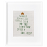 Needlepoint in a white frame with &