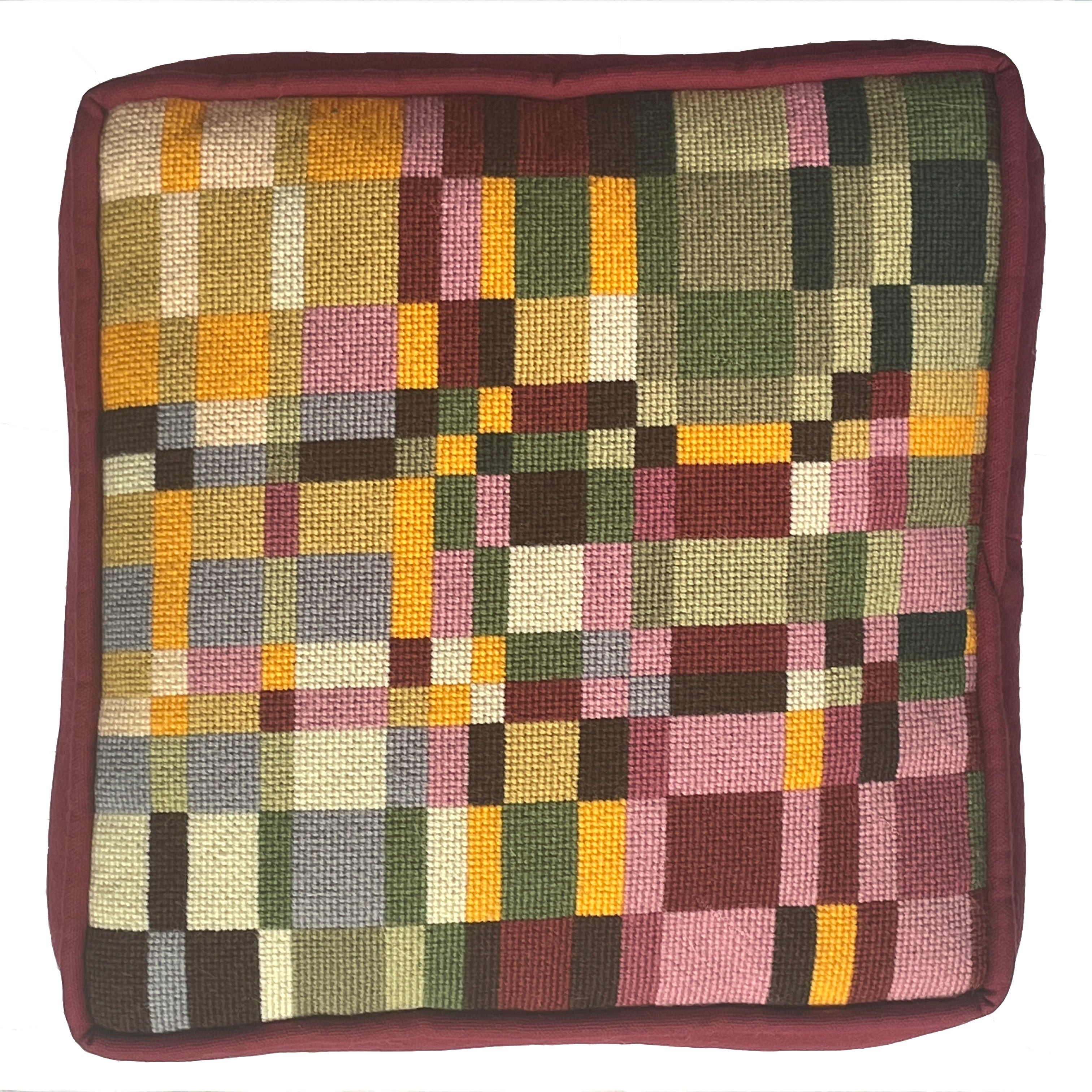 Square cushion with a multicolored checkered pattern on a white background