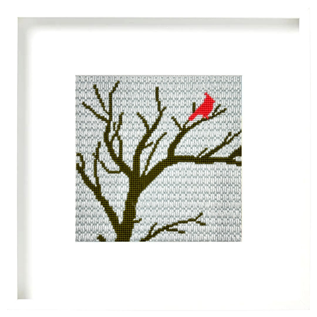 Needlepoint design of a cardinal in a tree