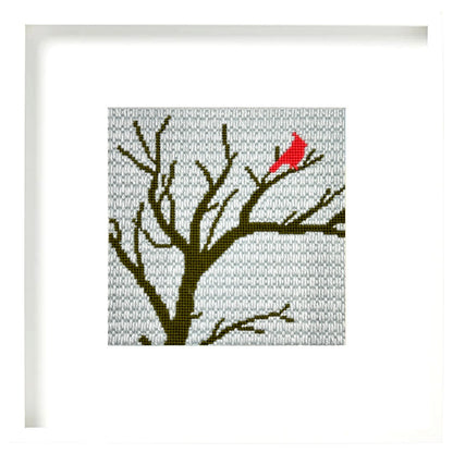 Needlepoint design of a cardinal in a tree