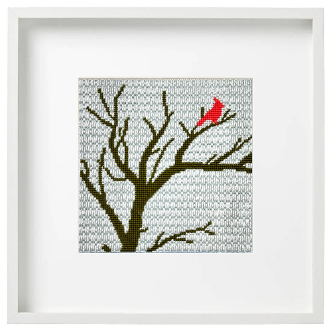 Winter Cardinal needlepoint design in a frame