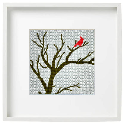 Winter Cardinal needlepoint design in a frame