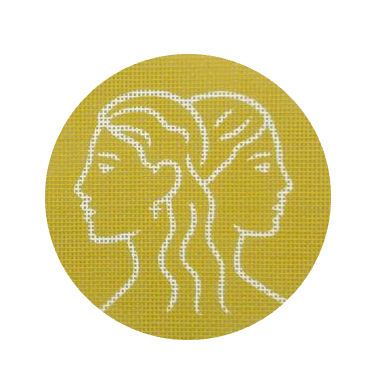Circular needlepoint with white Gemini Zodiac design on a mustard yellow background