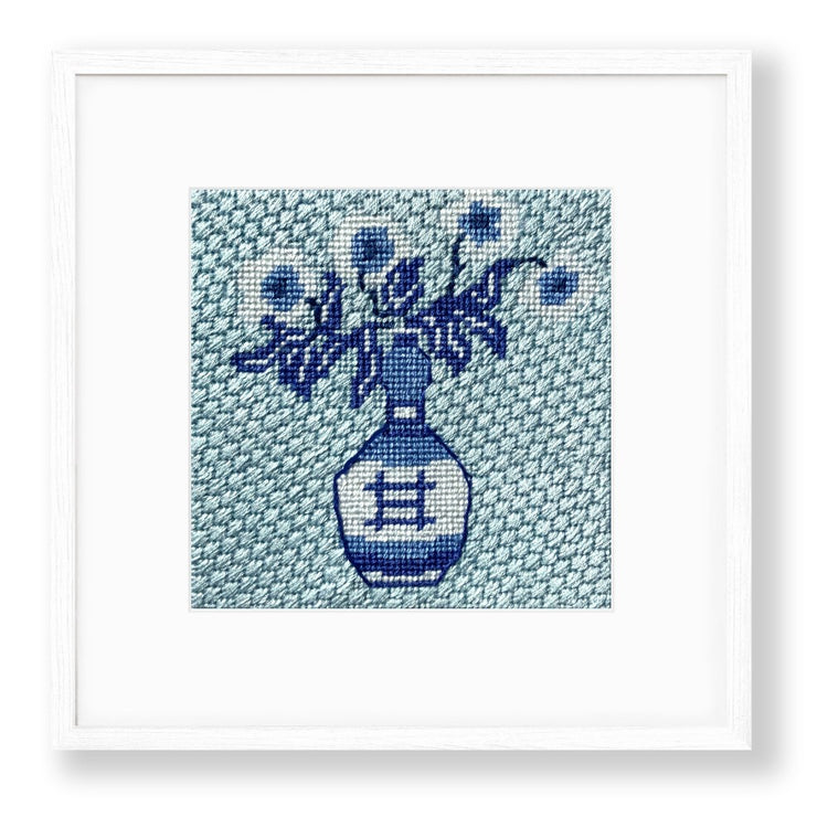 blue and white needlepoint design with decorative stitches
