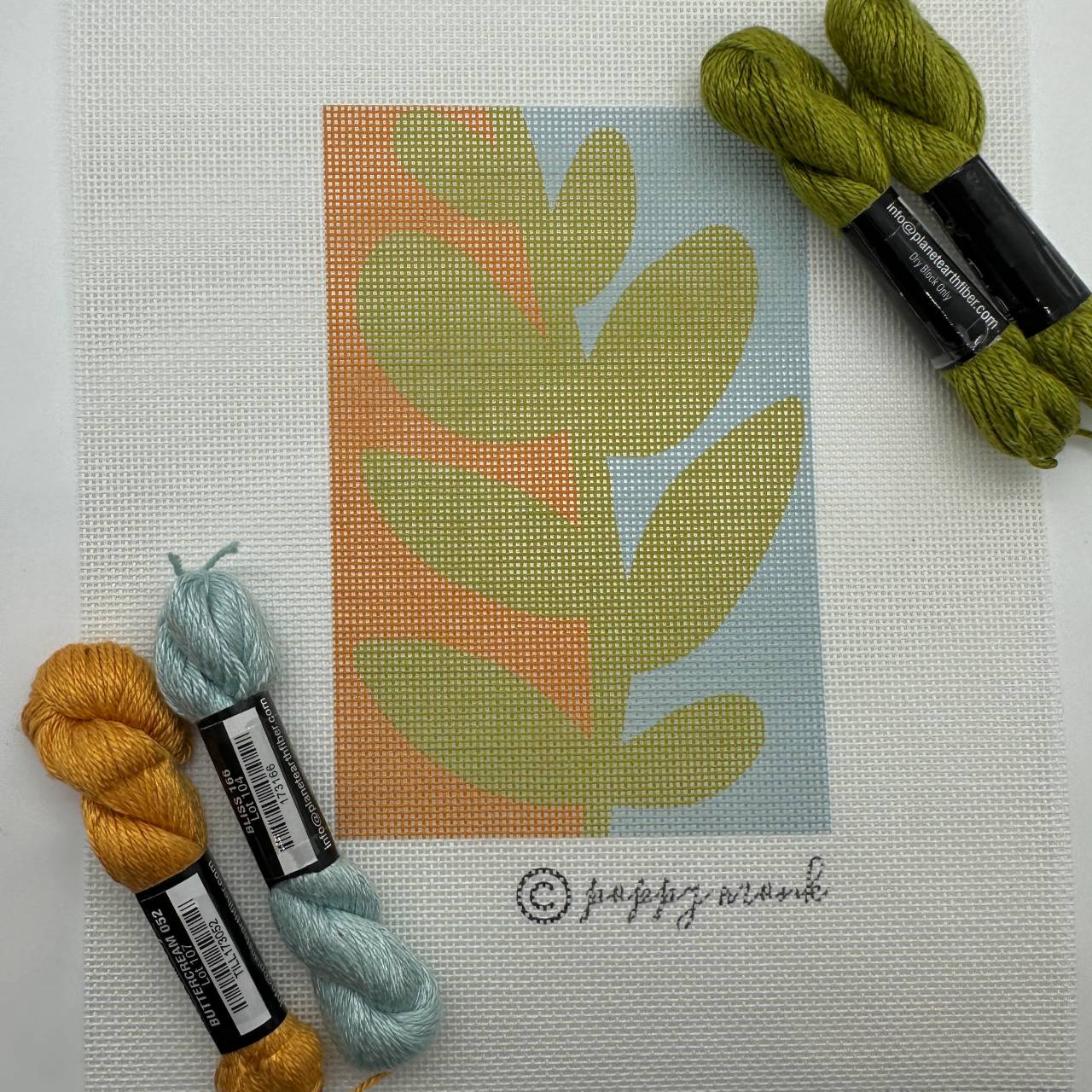 Modern needlepoint botanical leaf design with silk threads.