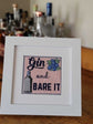 Gin and Bare It needlepoint design in a frame.